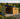 Wooden shed with a covered area for storing firewood, set against a scenic landscape.