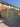 Wooden storage unit in front of a brick building