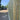 Wooden fence with a van and trees in the background