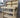 Indoor/Outdoor Pressure-Treated Double Shelf with back panel Workbench, a robust and versatile solution for all your workspace needs. Handcrafted in the UK, this workbench is constructed from high-quality, pressure-treated timber, ensuring durability and resistance to the elements, making it suitable for both indoor and outdoor use.